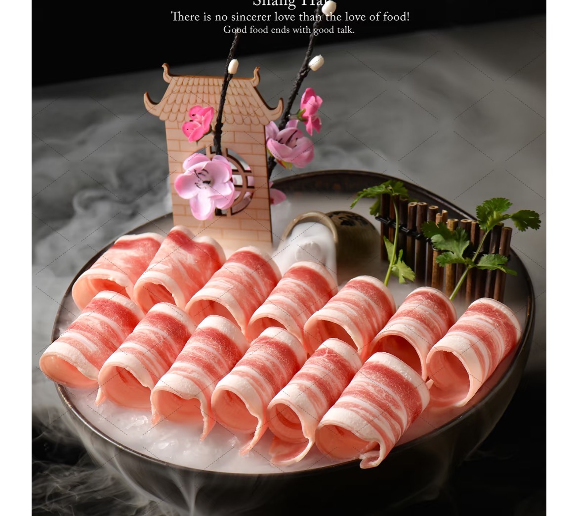 Rolled lamb slices on a smoking dry-ice platter with decorative arch