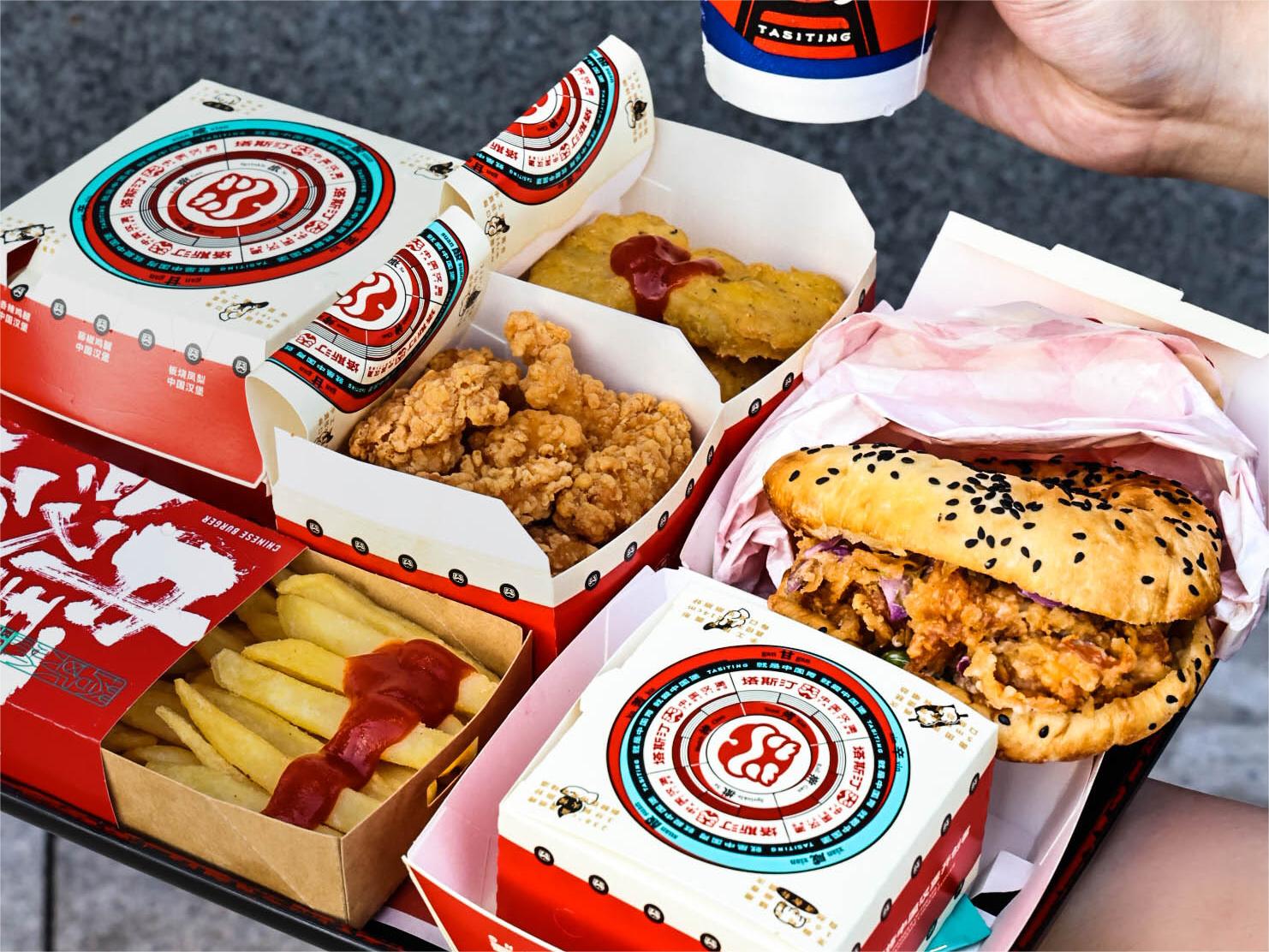 Tastien Chinese-burger combo spread with fries, popcorn chicken and nuggets